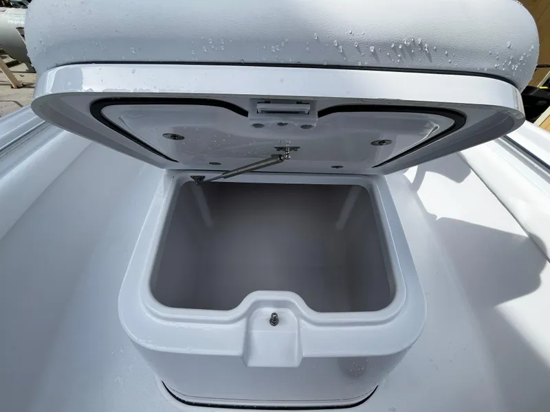 Slide: The Image of Open storage compartment on 2024 Sportsman Masters 247OE Bay Boat. - 23