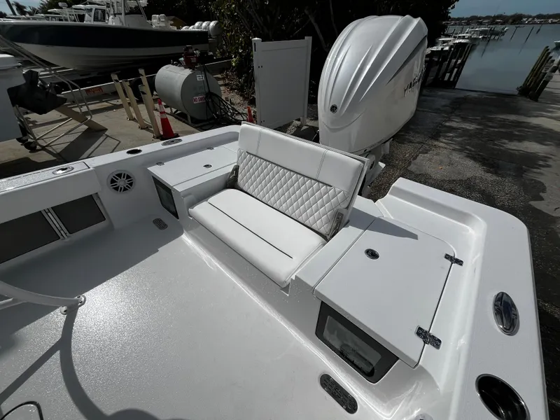 Slide: The Image of 2024 Sportsman Masters 247OE Bay Boat, rear seating and engine view. - 8