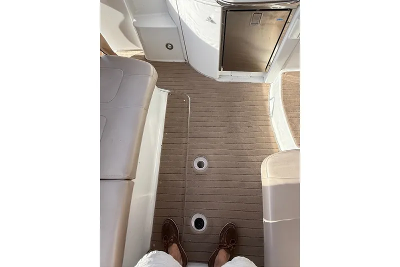 Slide: The Image of 2009 Formula 31 Performance Cruiser interior with beige flooring and seating. - 10