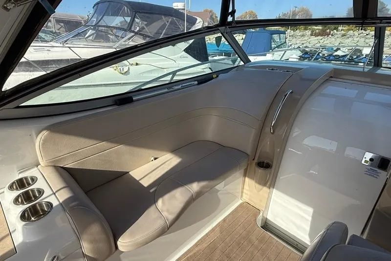 Slide: The Image of 2009 Formula 31 Performance Cruiser interior with beige seating and cup holders. - 11