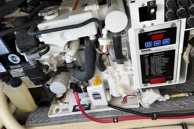 Slide: The Image of Engine compartment of a 2009 Formula 31 Performance Cruiser with Kohler digital control panel. - 22