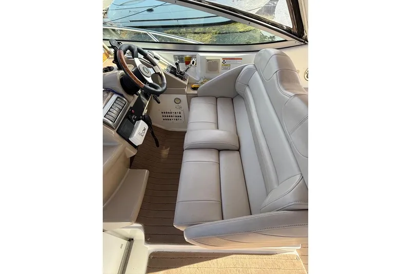 Slide: The Image of 2009 Formula 31 Performance Cruiser cockpit with leather seating and steering wheel. - 3