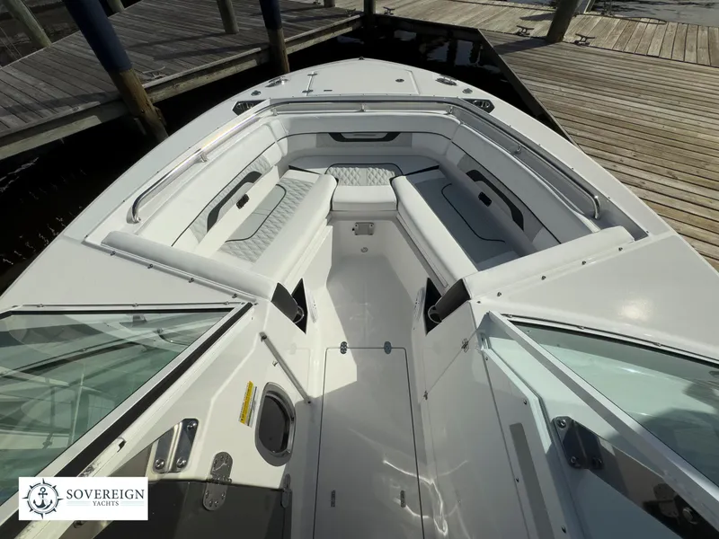 Slide: The Image of 2024 Blackfin 252 DC boat interior with seating and Sovereign Yacht logo. - 22
