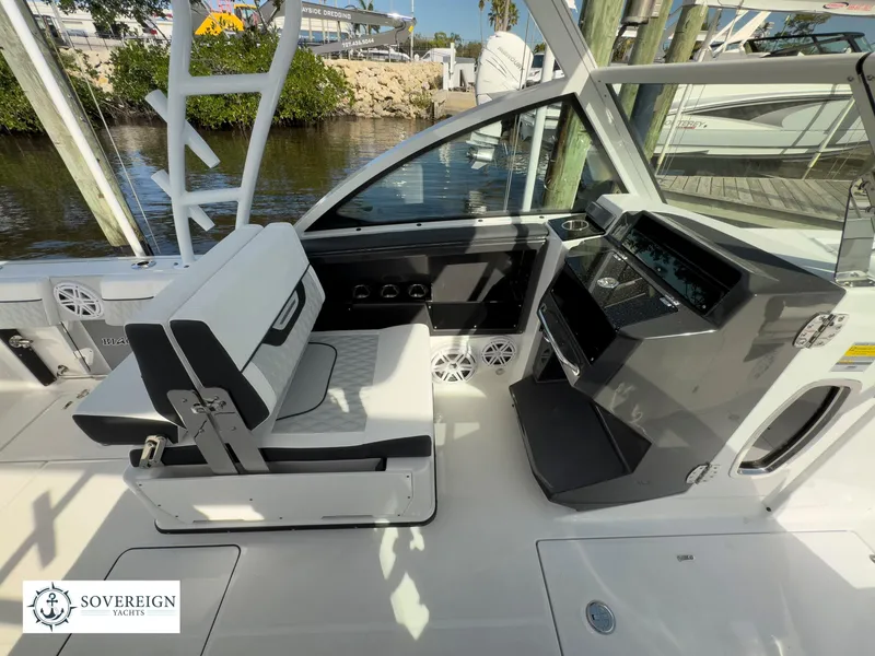 Slide: The Image of 2024 Blackfin 252 DC boat interior with seating and control panel. - 26