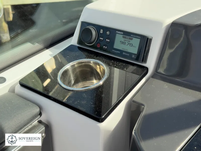 Slide: The Image of 2024 Blackfin 252 DC boat console with Fusion stereo and cup holder. - 30