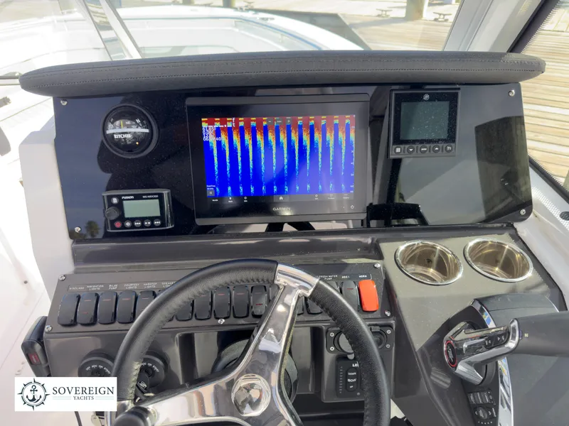 Slide: The Image of 2024 Blackfin 252 DC boat dashboard with advanced navigation and control systems. - 37