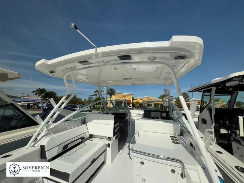 Slide: The Image of 2024 Blackfin 272 DC boat interior with seating and helm station. - 13