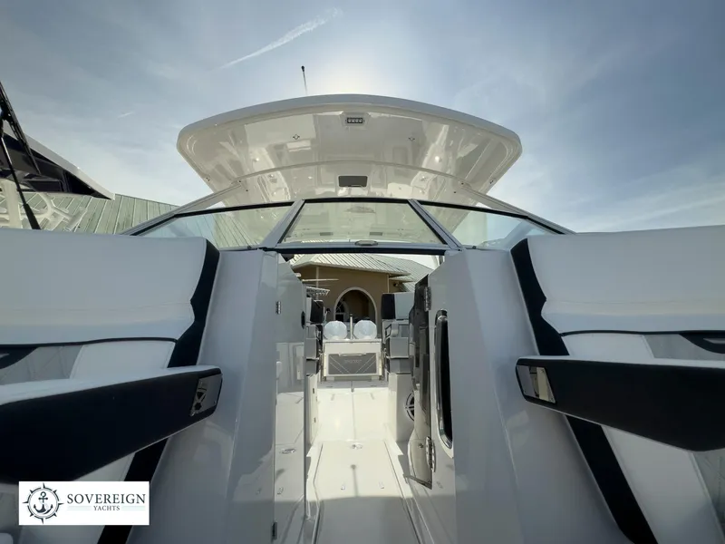 Slide: The Image of 2024 Blackfin 272 DC boat interior view with Sovereign Yacht logo. - 19