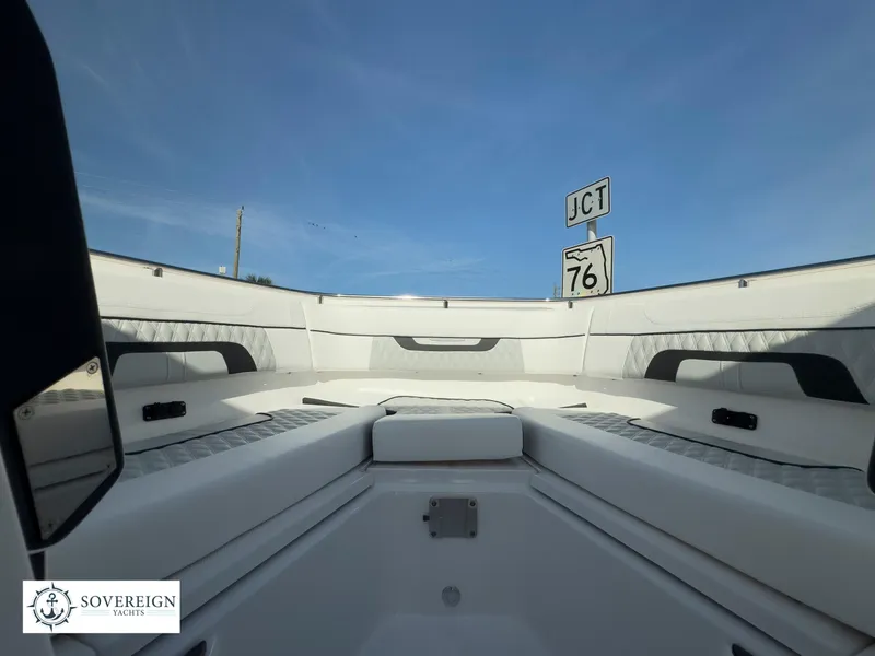 Slide: The Image of 2024 Blackfin 272 DC boat interior with Sovereign Yacht logo. - 21