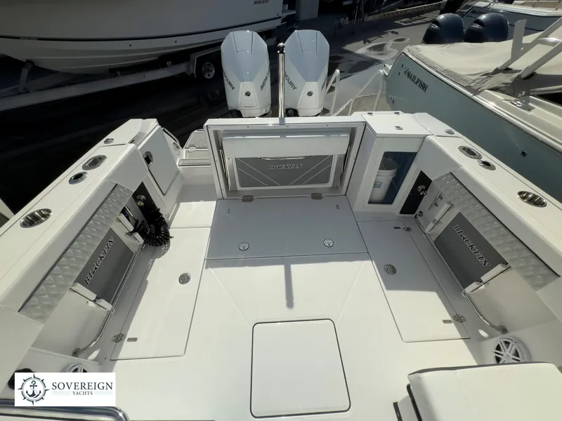 Slide: The Image of 2024 Blackfin 272 DC boat deck with twin engines at Sovereign Yachts. - 41
