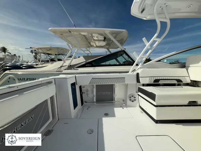 Slide: The Image of 2024 Blackfin 272 DC boat interior with seating and storage compartments. - 44