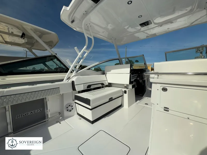 Slide: The Image of 2024 Blackfin 272 DC boat interior with seating and storage compartments. - 45