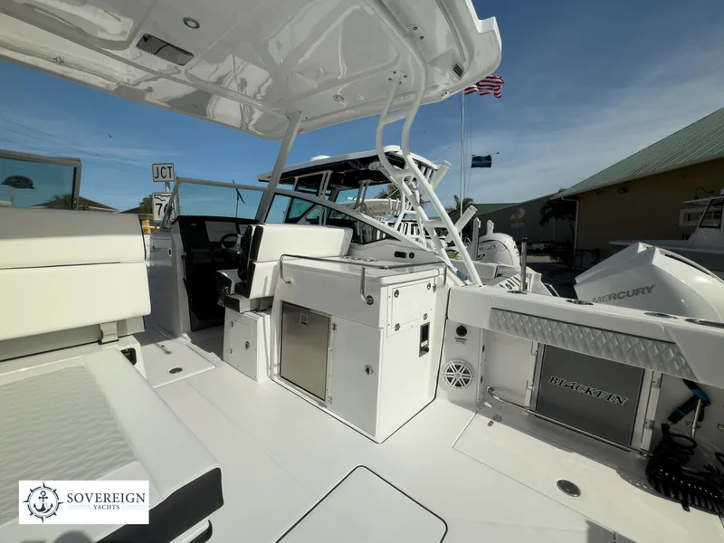 Slide: The Image of 2024 Blackfin 272 DC boat interior with seating and storage compartments. - 46