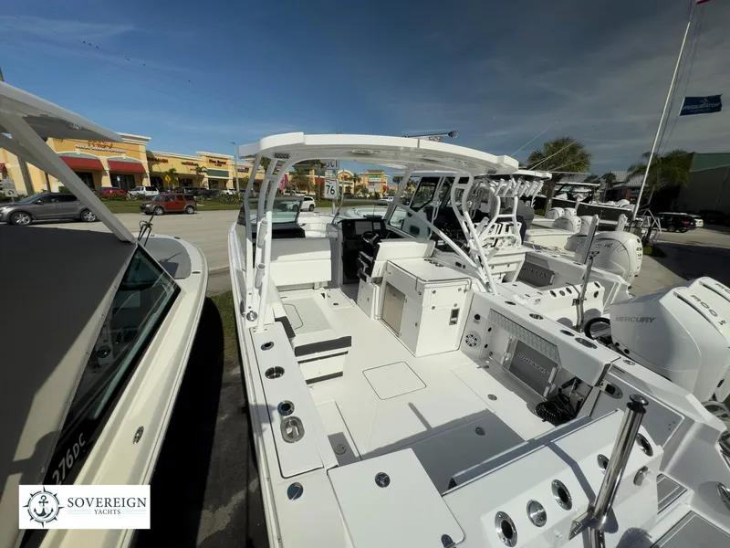 Slide: The Image of 2024 Blackfin 272 DC boat interior at Sovereign Yacht dealership. - 7