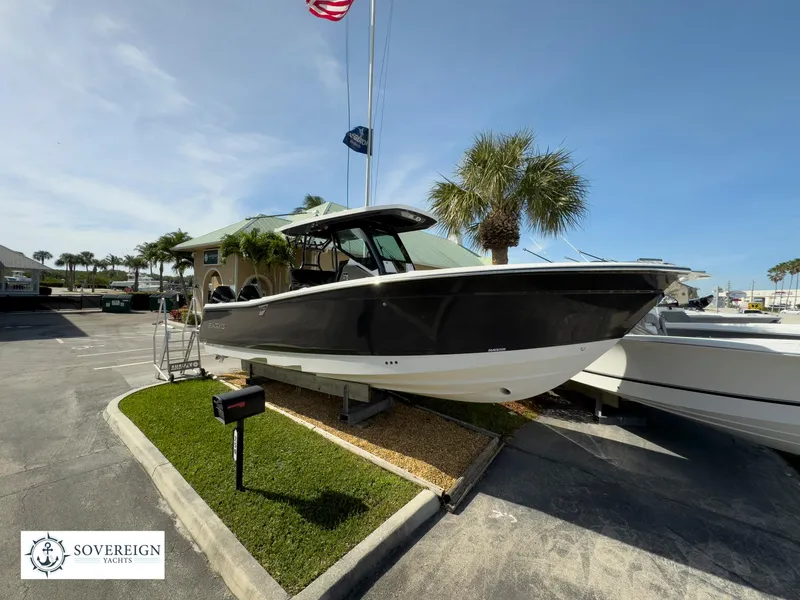 Slide: The Image of 2024 Blackfin 302 boat displayed at Sovereign Yachts dealership. - 1