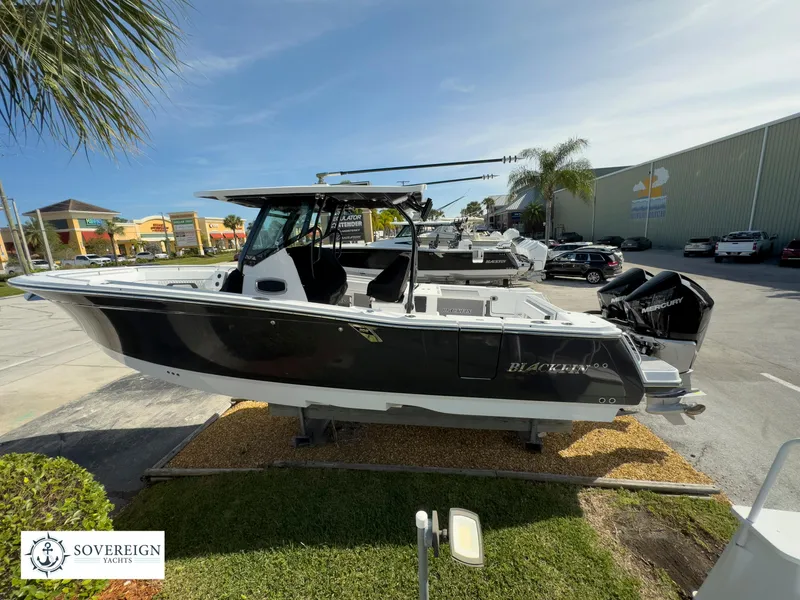 Slide: The Image of 2024 Blackfin 302 boat on display at Sovereign Yachts dealership. - 10