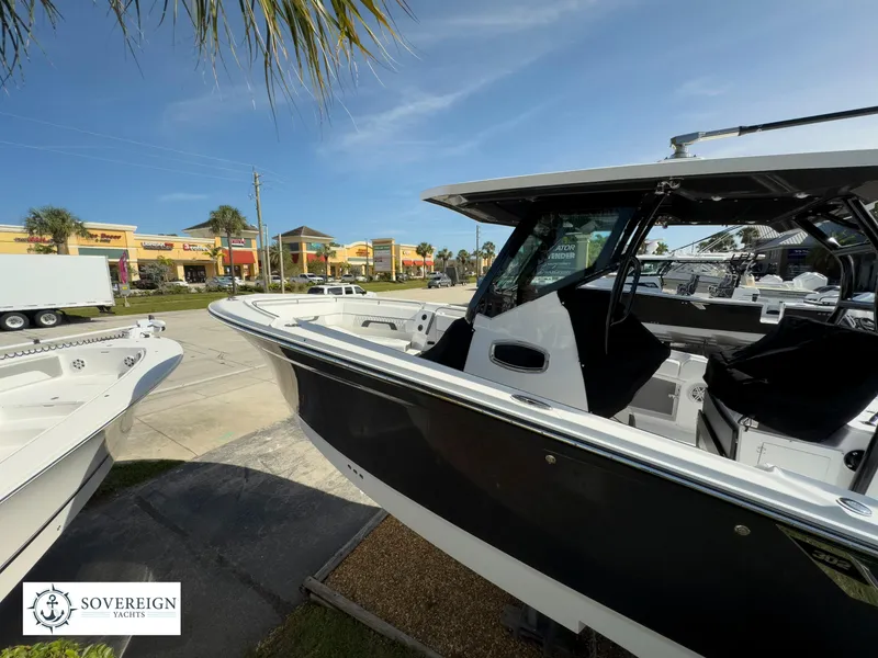 Slide: The Image of 2024 Blackfin 302 boat displayed at Sovereign Yacht dealership. - 11