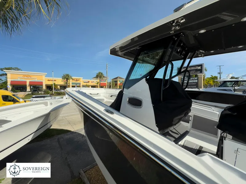 Slide: The Image of 2024 Blackfin 302 boat displayed at Sovereign Yachts dealership. - 14
