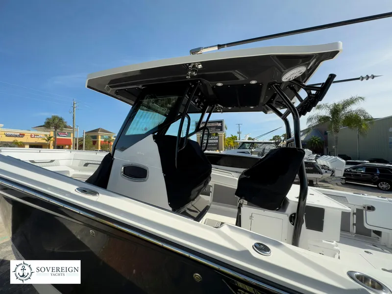Slide: The Image of 2024 Blackfin 302 boat with T-top and seating, displayed at Sovereign Yacht dealership. - 15