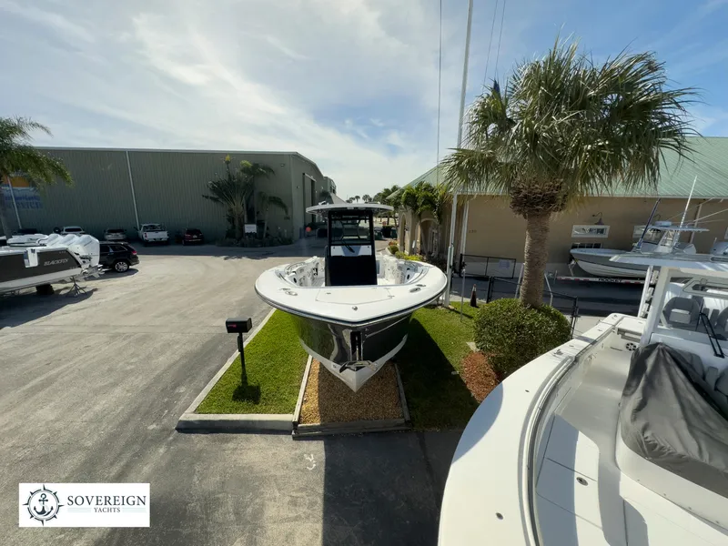 Slide: The Image of 2024 Blackfin 302 boat displayed at Sovereign Yacht dealership. - 16