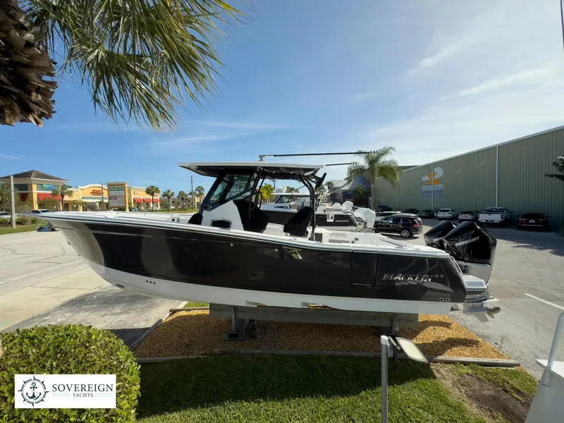 Slide: The Image of 2024 Blackfin 302 boat on display at Sovereign Yachts dealership. - 17