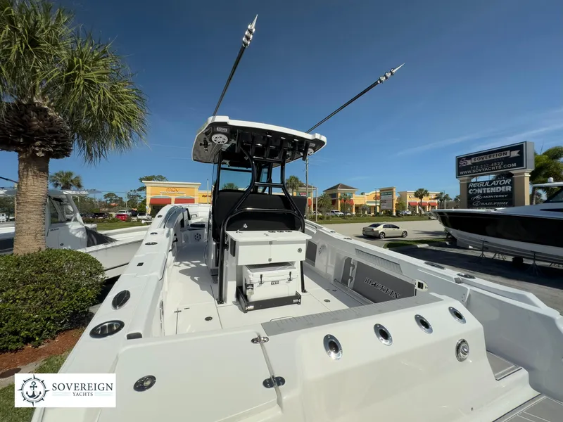 Slide: The Image of 2024 Blackfin 302 boat at Sovereign Yacht dealership, outdoor display. - 18