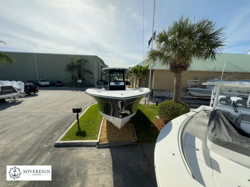 Slide: The Image of 2024 Blackfin 302 boat displayed at Sovereign Yachts dealership. - 2