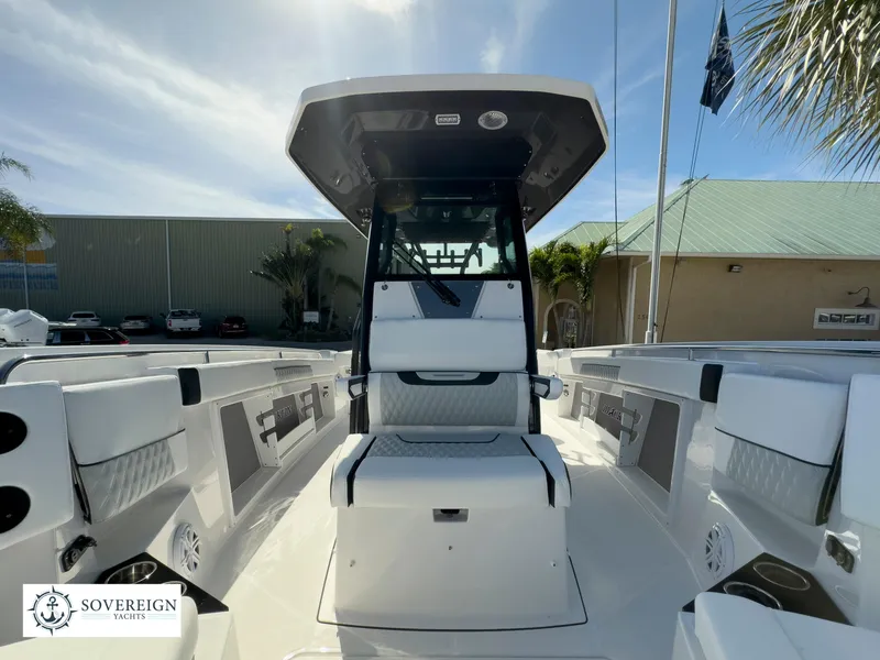 Slide: The Image of 2024 Blackfin 302 boat interior with seating and console, displayed at Sovereign Yachts. - 21