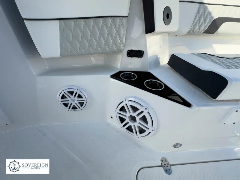 Slide: The Image of 2024 Blackfin 302 boat interior with speakers and cup holders. Sovereign Yachts logo visible. - 22