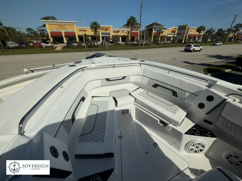 Slide: The Image of 2024 Blackfin 302 boat interior with white seating and modern design. - 25