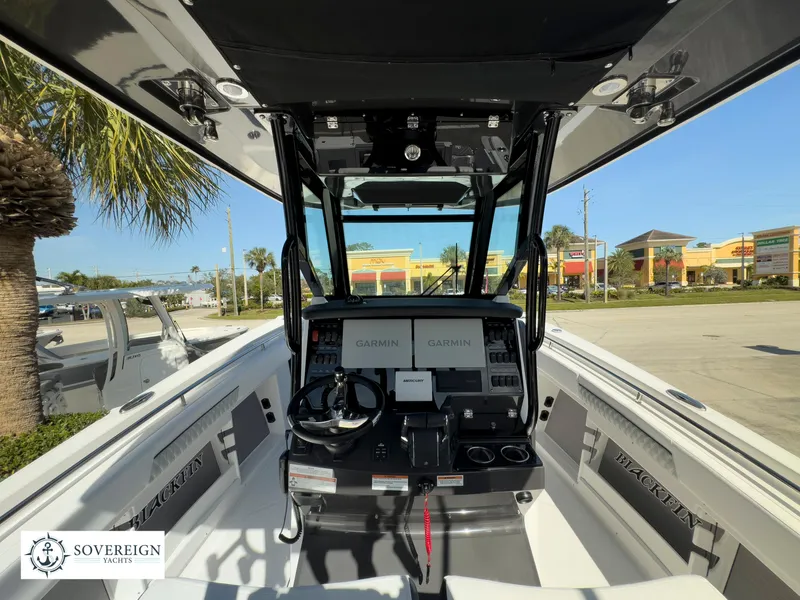 Slide: The Image of 2024 Blackfin 302 boat cockpit with Garmin navigation system. - 26