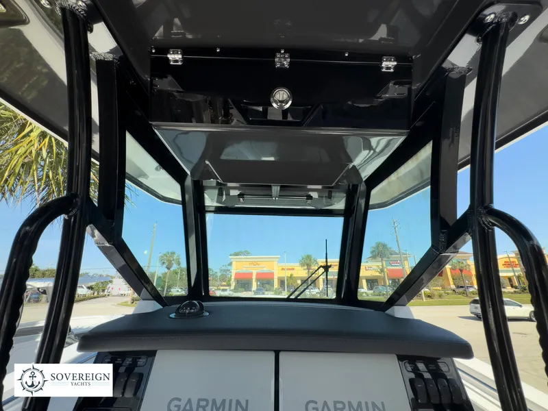 Slide: The Image of 2024 Blackfin 302 boat dashboard with Garmin navigation system. - 30