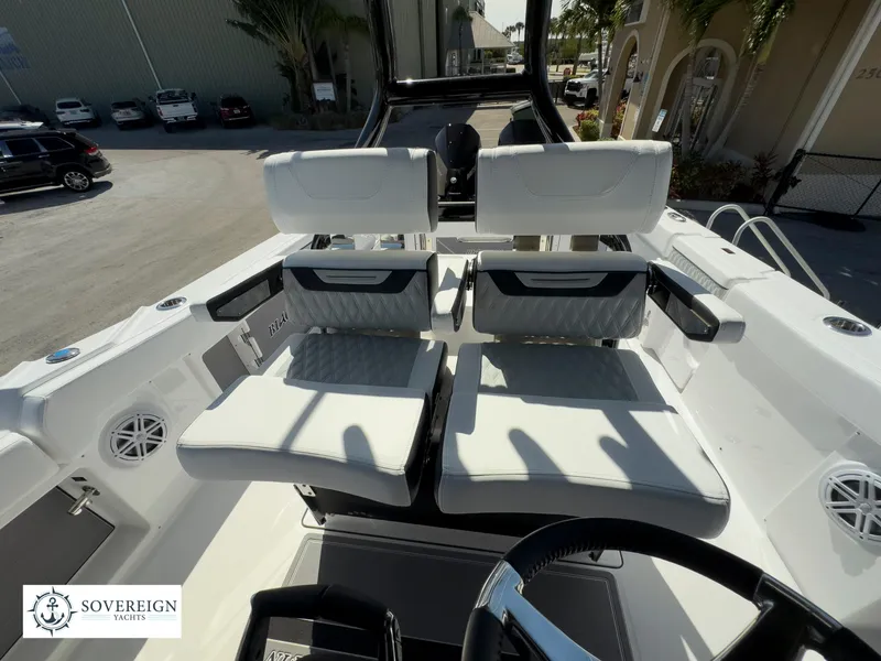 Slide: The Image of 2024 Blackfin 302 boat interior with dual seating and Sovereign Yachts logo. - 33
