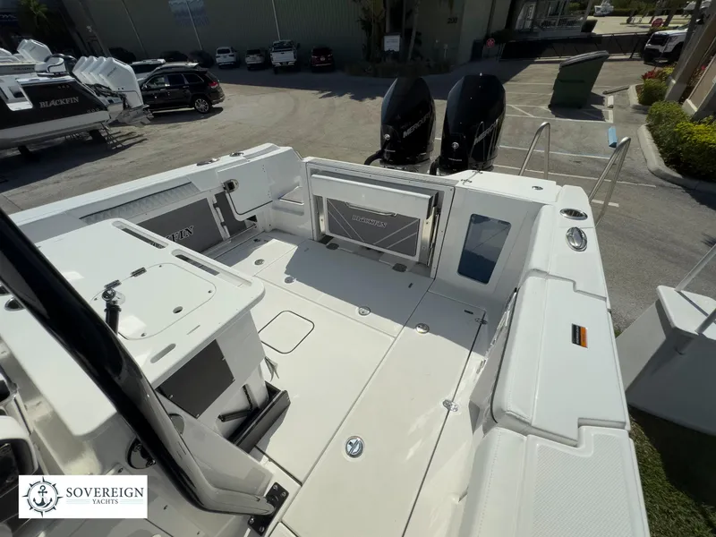 Slide: The Image of 2024 Blackfin 302 boat deck with twin outboard engines at Sovereign Yacht. - 35
