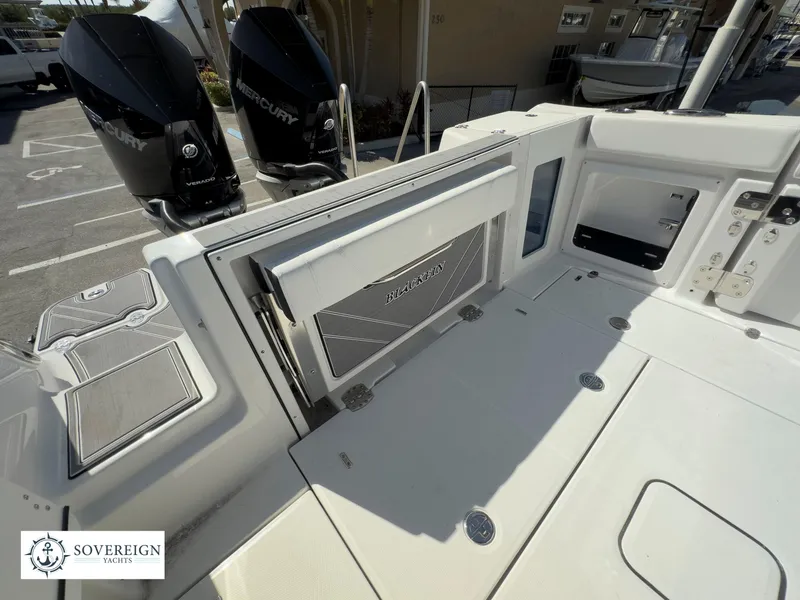 Slide: The Image of 2024 Blackfin 302 boat deck with Mercury engines, Sovereign Yachts logo. - 39