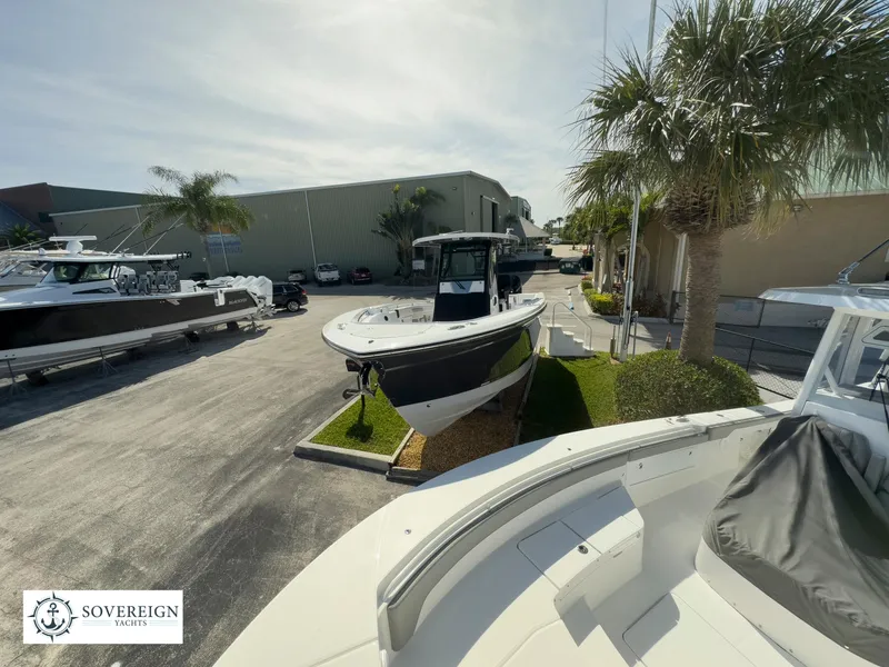 Slide: The Image of 2024 Blackfin 302 boat displayed at Sovereign Yachts dealership. - 4