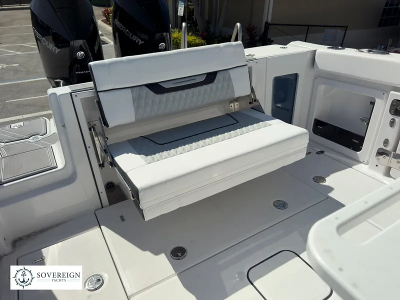 Slide: The Image of 2024 Blackfin 302 boat with foldable seating and twin Mercury engines. - 43