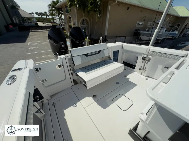 Slide: The Image of 2024 Blackfin 302 boat deck with seating and twin engines. - 44