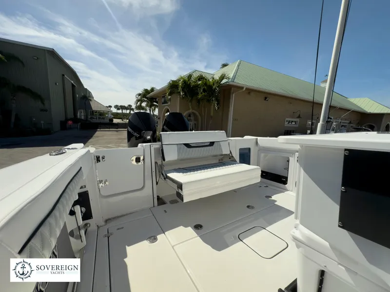 Slide: The Image of 2024 Blackfin 302 boat deck with seating and storage compartments. - 45