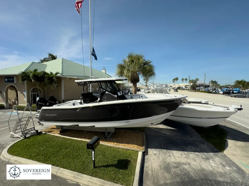 Slide: The Image of 2024 Blackfin 302 boat displayed at Sovereign Yacht dealership. - 5