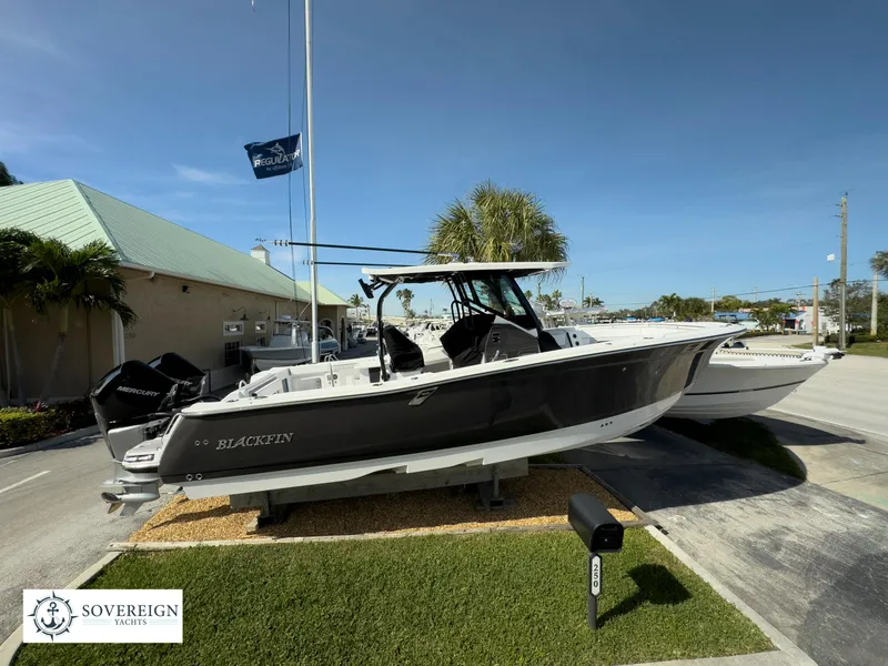 Slide: The Image of 2024 Blackfin 302 boat on display at Sovereign Yachts dealership. - 6