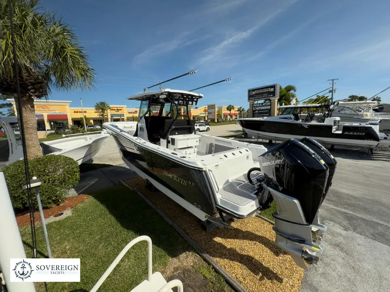 Slide: The Image of 2024 Blackfin 302 boat displayed at Sovereign Yachts dealership. - 9
