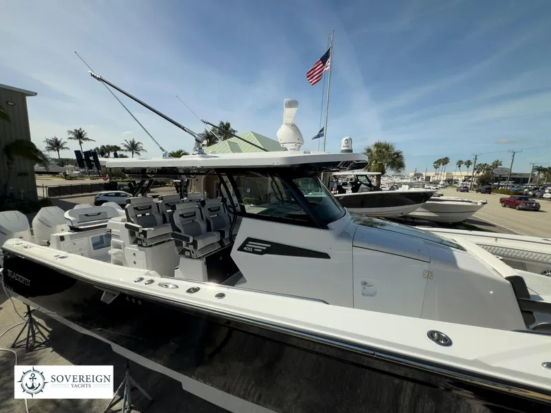 Slide: The Image of 2024 Blackfin 400 boat displayed at Sovereign Yachts dealership. - 11