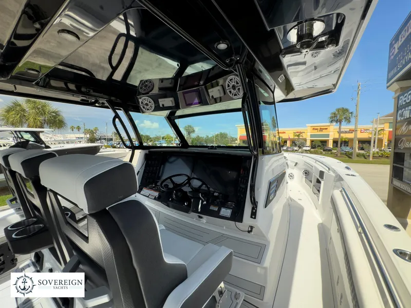 Slide: The Image of 2024 Blackfin 400 boat interior with modern dashboard and seating. - 19