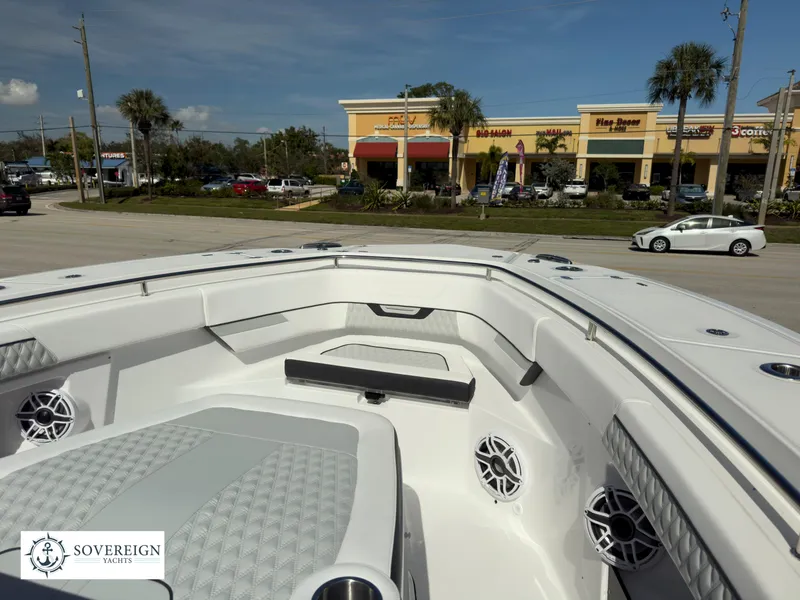 Slide: The Image of 2024 Blackfin 400 boat interior with seating and speakers, Sovereign Yachts logo. - 22