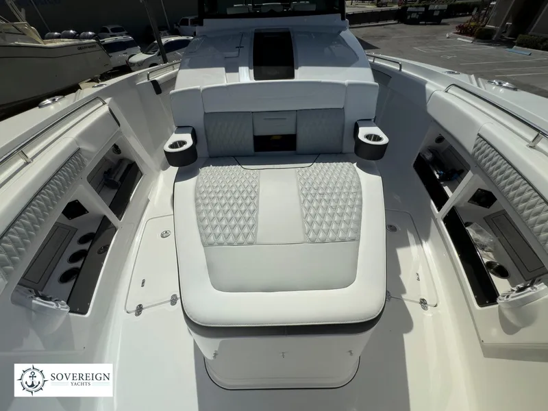 Slide: The Image of 2024 Blackfin 400 boat interior with luxurious seating and storage compartments. - 24