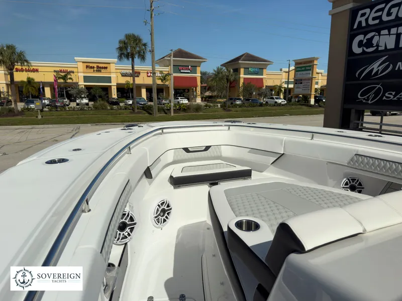 Slide: The Image of 2024 Blackfin 400 boat interior with seating and speakers, Sovereign Yachts logo. - 28
