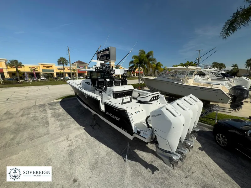 Slide: The Image of 2024 Blackfin 400 boat with triple Mercury engines on display at Sovereign Yacht dealership. - 3