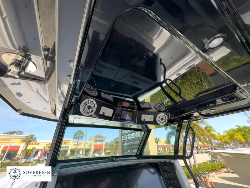 Slide: The Image of 2024 Blackfin 400 boat console with advanced electronics and speakers. - 34