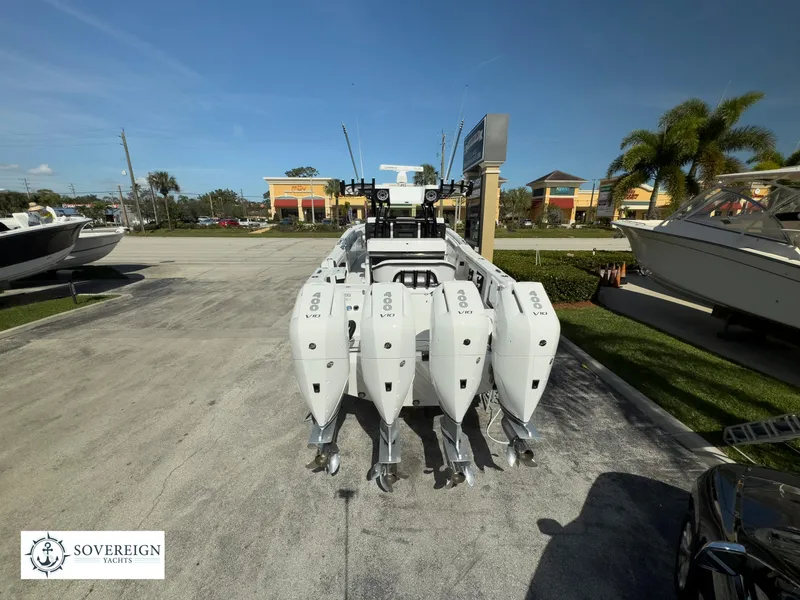 Slide: The Image of 2024 Blackfin 400 boat with quad outboard engines at Sovereign Yacht dealership. - 4